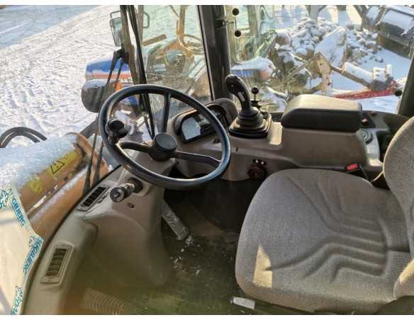 Case 21E (šarnyrinis krautuvas)